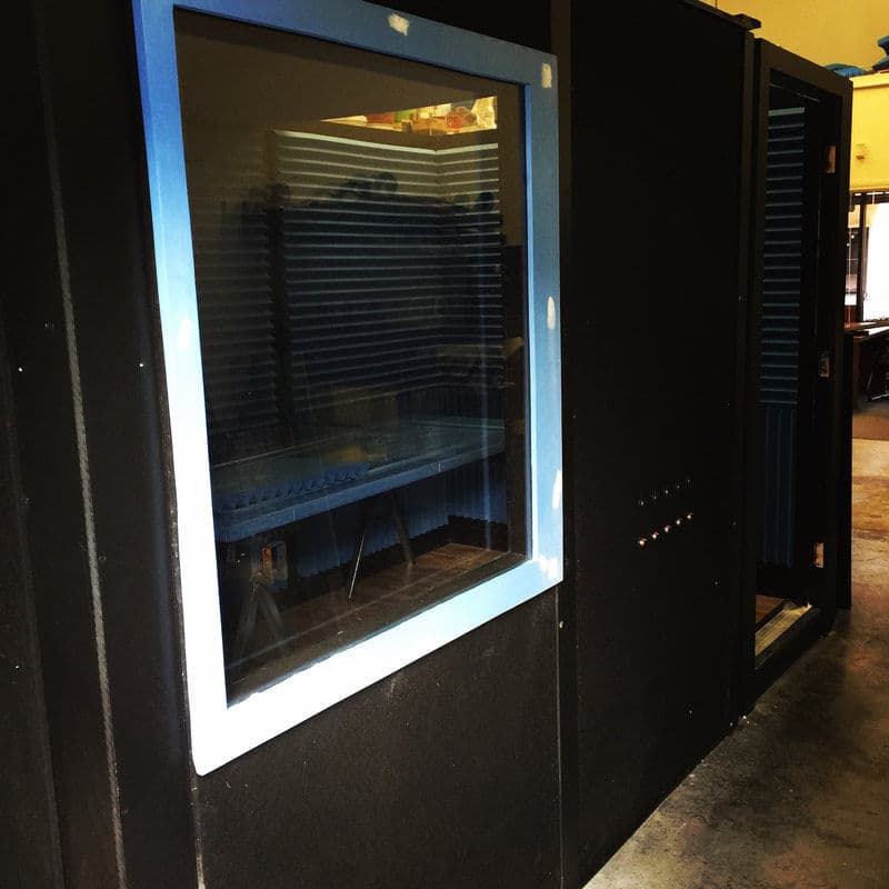 Custom spray booth with glass window for professional painting and finishing projects.